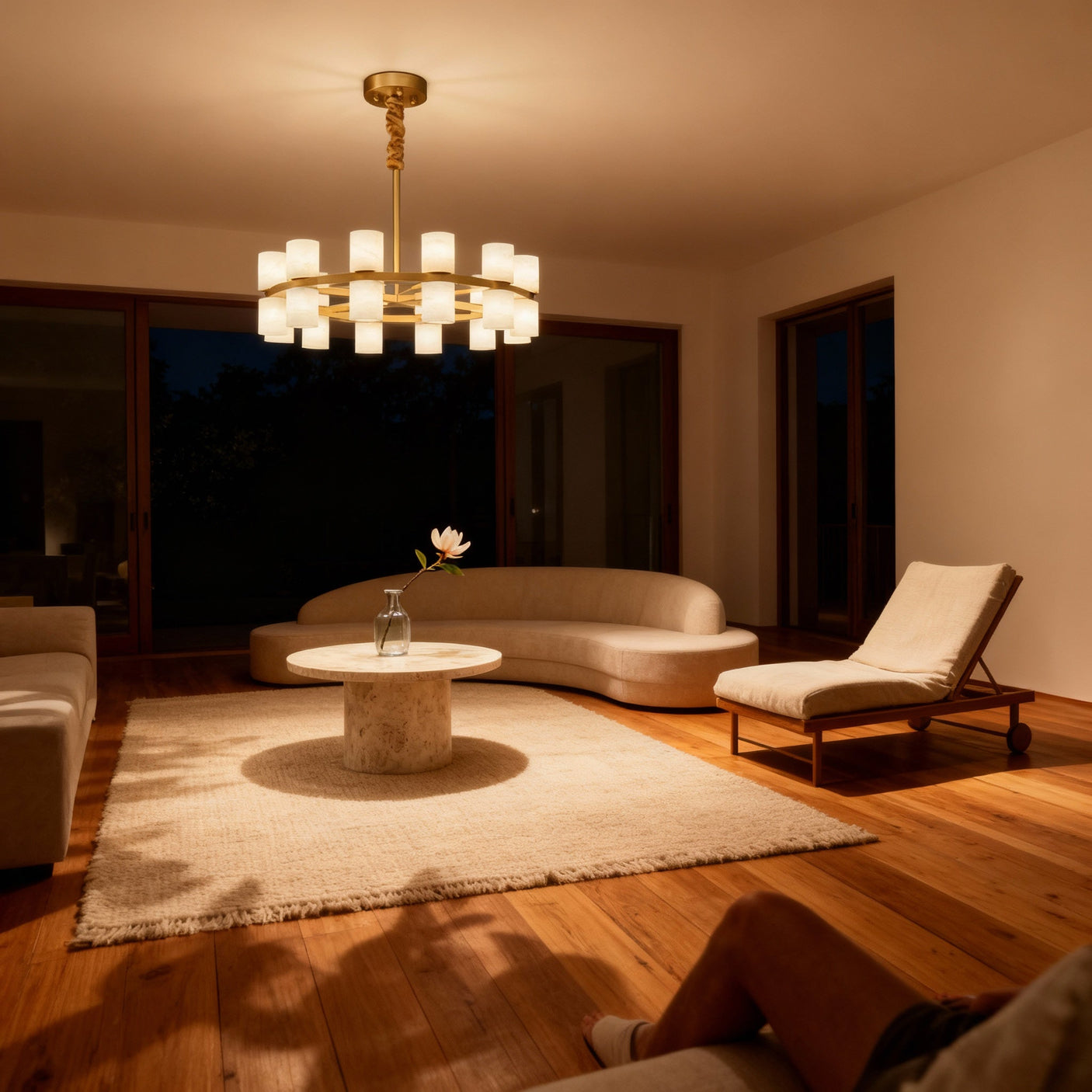 Enzo chandelier lit at dusk in a living room, room scene