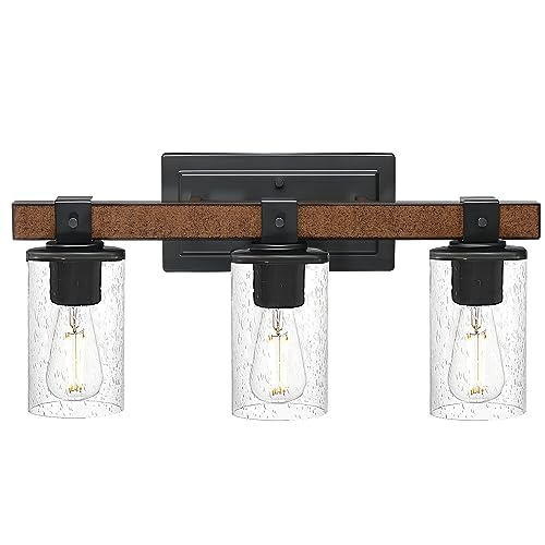 Jarl vanity light with seeded glass glowing — studio white