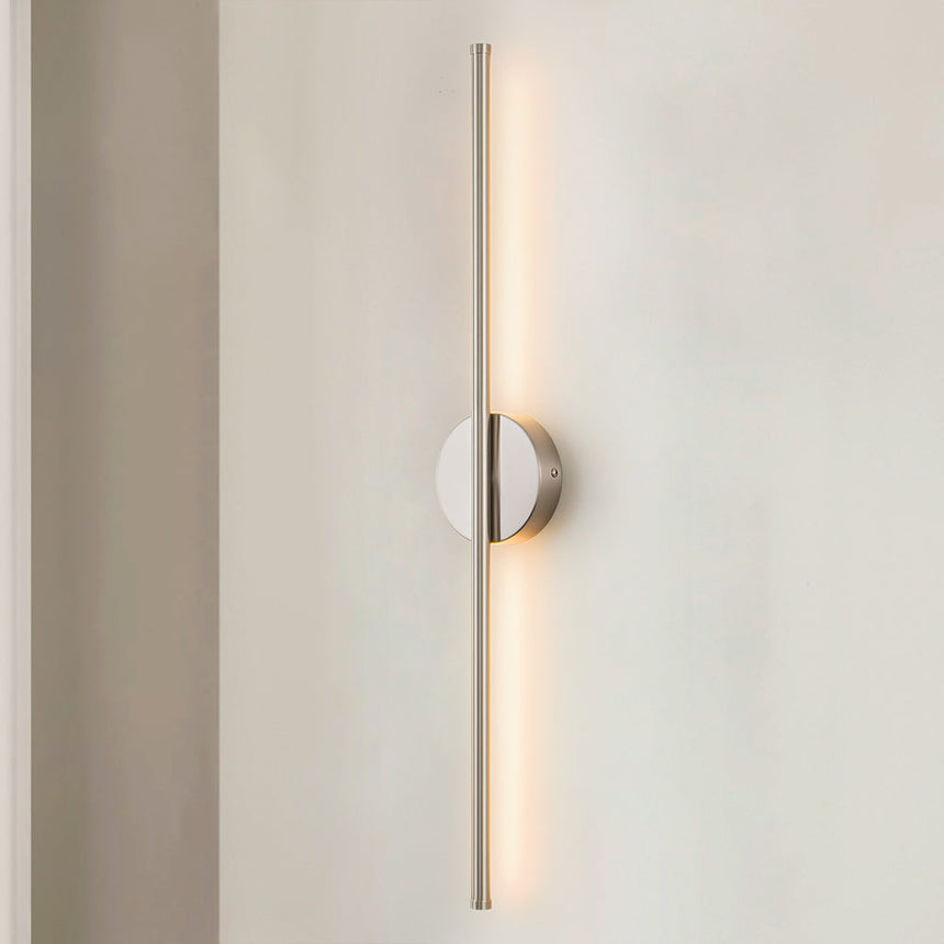 Metal LED wall sconce with modern finish and cozy warm glow