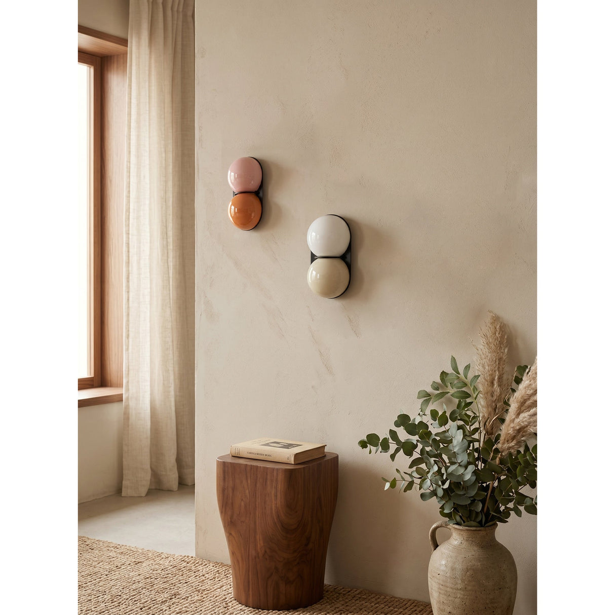 Matteo twin-globe sconces on a warm plaster wall — lifestyle