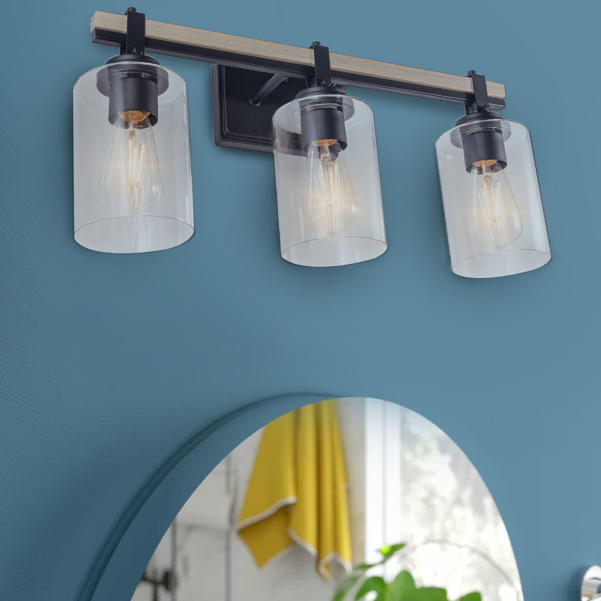 Eero vanity light on a blue bathroom wall, room scene