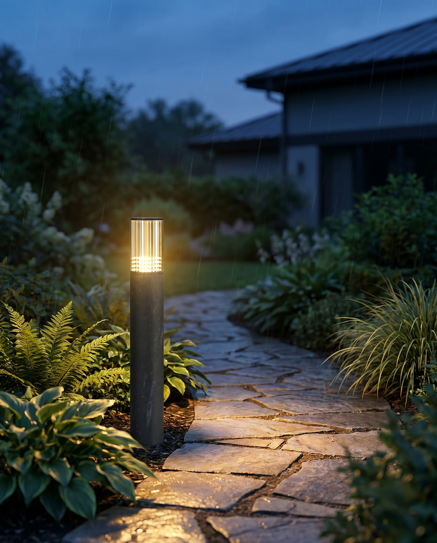 Cylinder LED garden pillar light along path at dusk, lifestyle