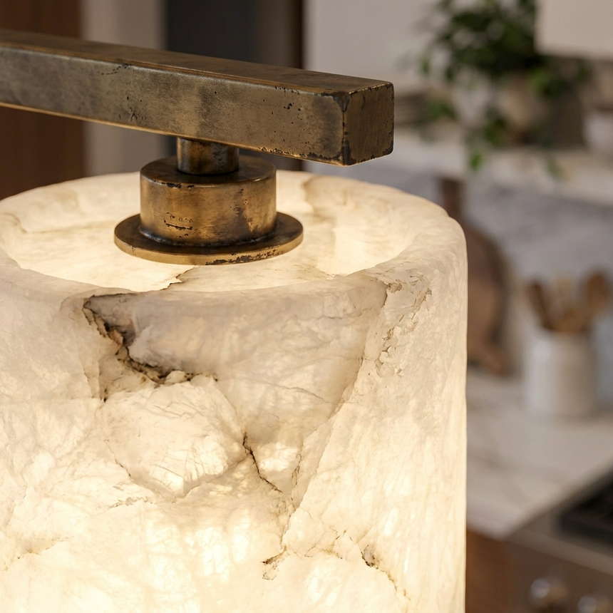 Macro of hand-carved alabaster shade veining and aged-brass fitting
