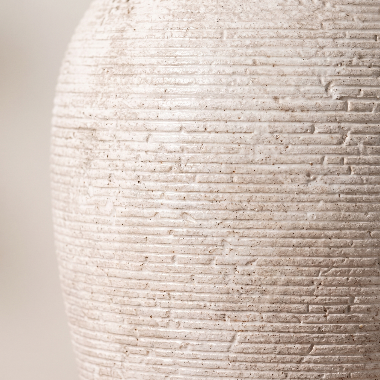 Willa vase ribbed ceramic texture, close-up on white