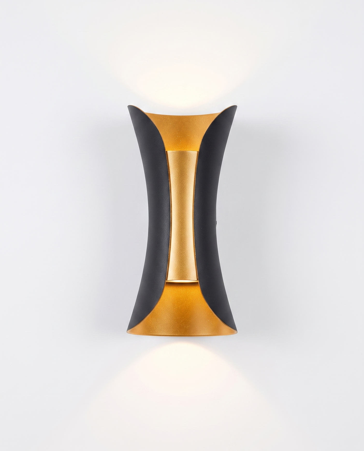 Marlow curved up/down wall sconce, black with gold reflector, studio on white