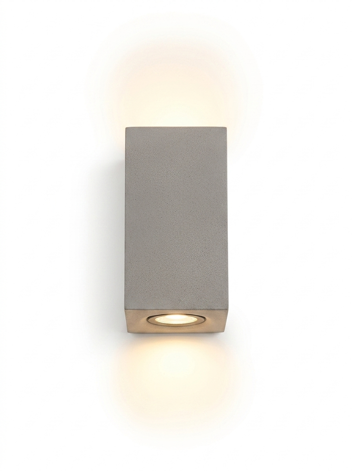 Ilse tall rectangular concrete up-down wall light in light concrete gray on a studio white background