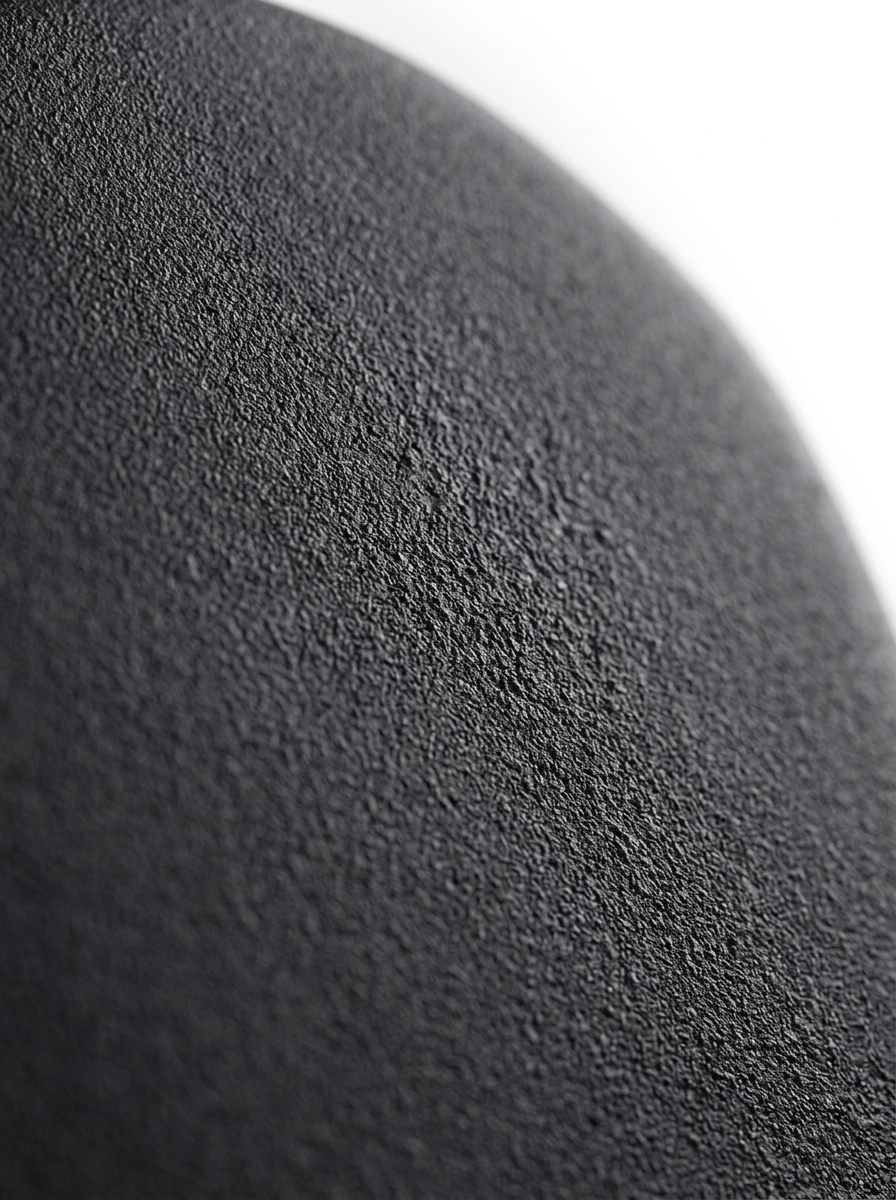 Macro of the matte charcoal-black powder-coat texture