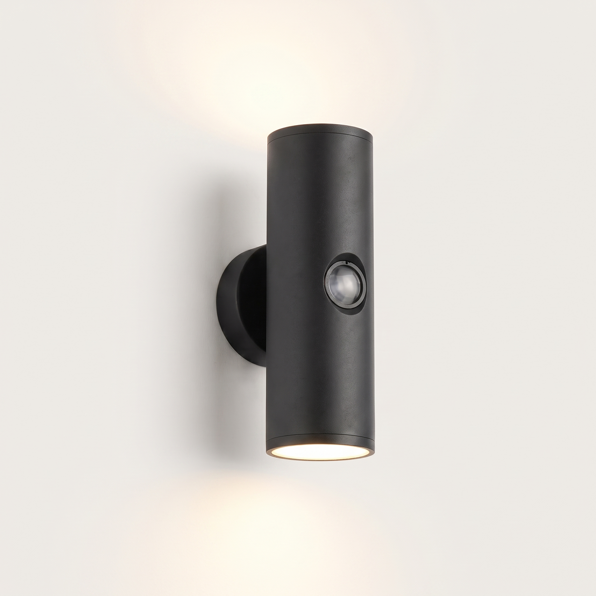 Vega up-and-down outdoor wall light lit warm on a soft off-white studio background