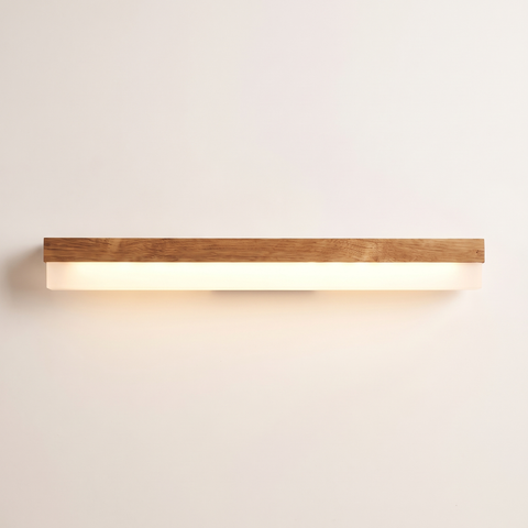 Nara oak LED vanity light bar lit warm on a soft off-white studio background