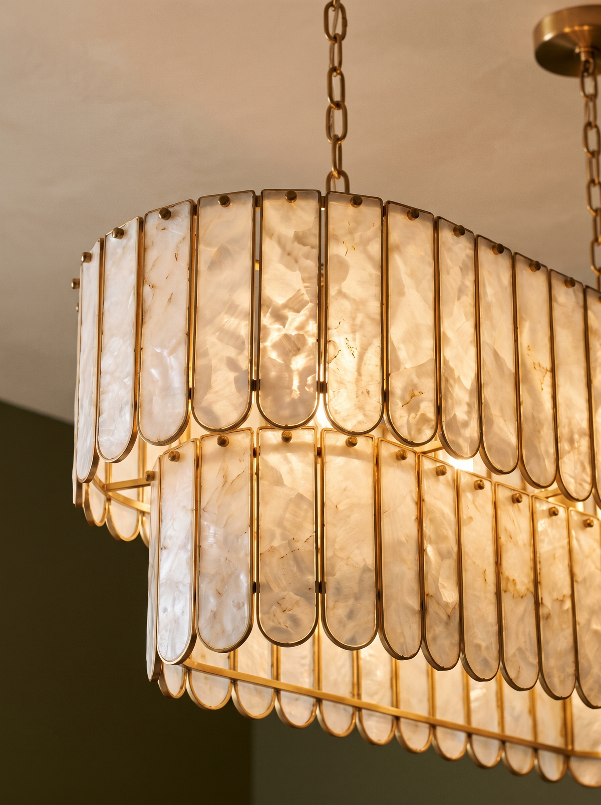 Lifestyle: close-up of Marelle's pearl-shell slats and brass frame, lit