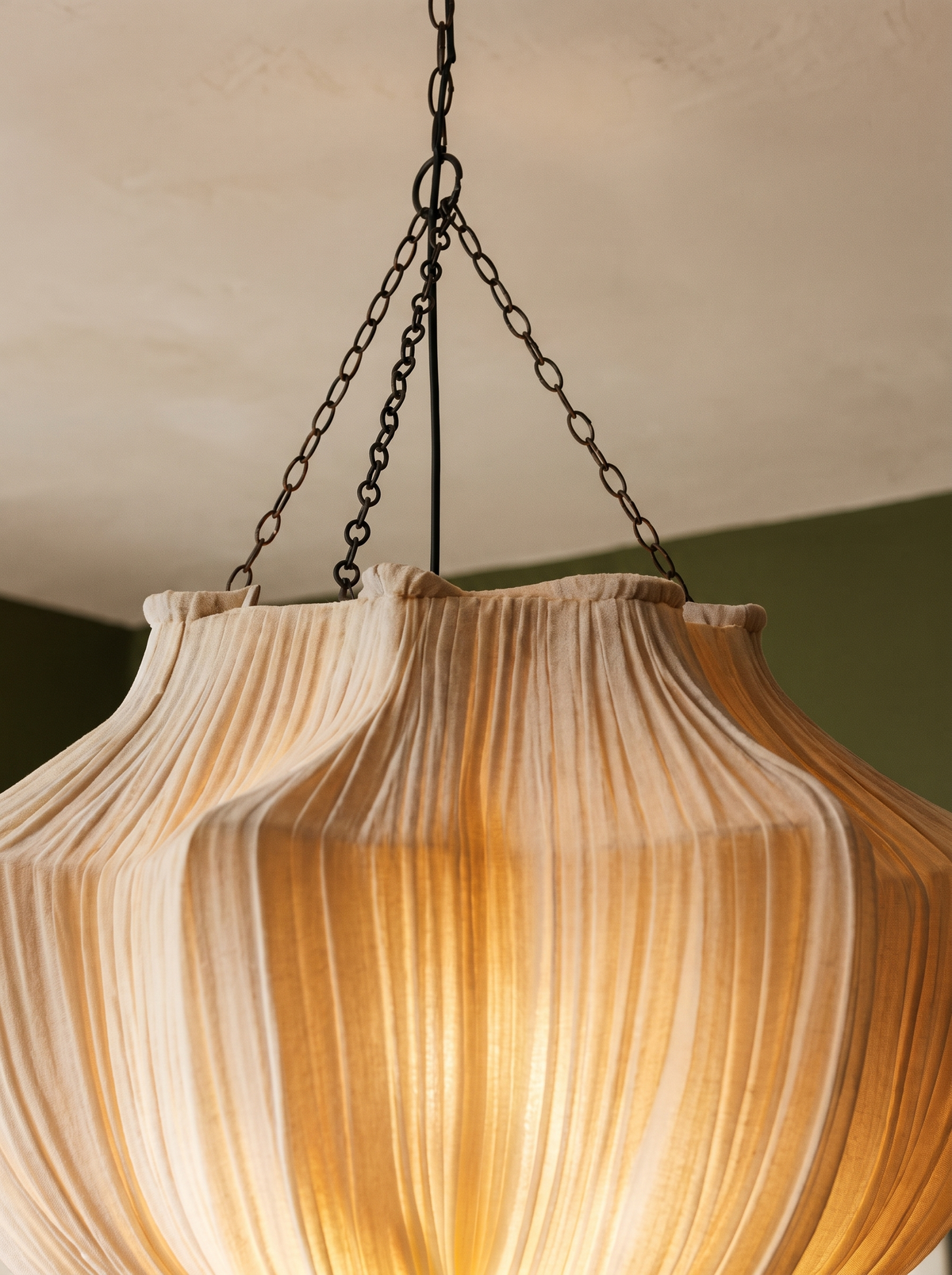 Lifestyle: close-up of Nessa's pleated fabric ridges, lit