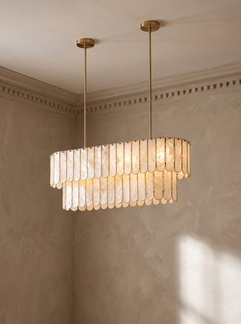 Marelle oval shell chandelier hanging in a plaster-moulded corner