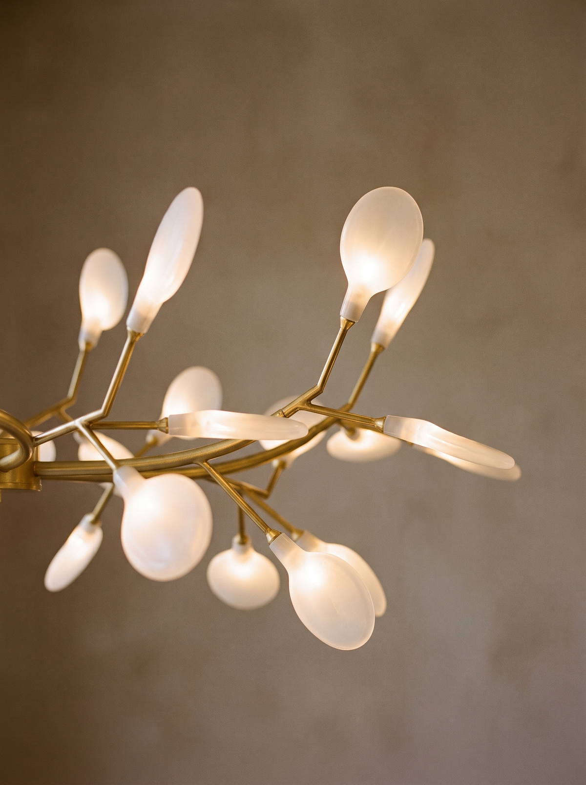Lifestyle: close-up of Luce's glass leaf shades glowing like fireflies