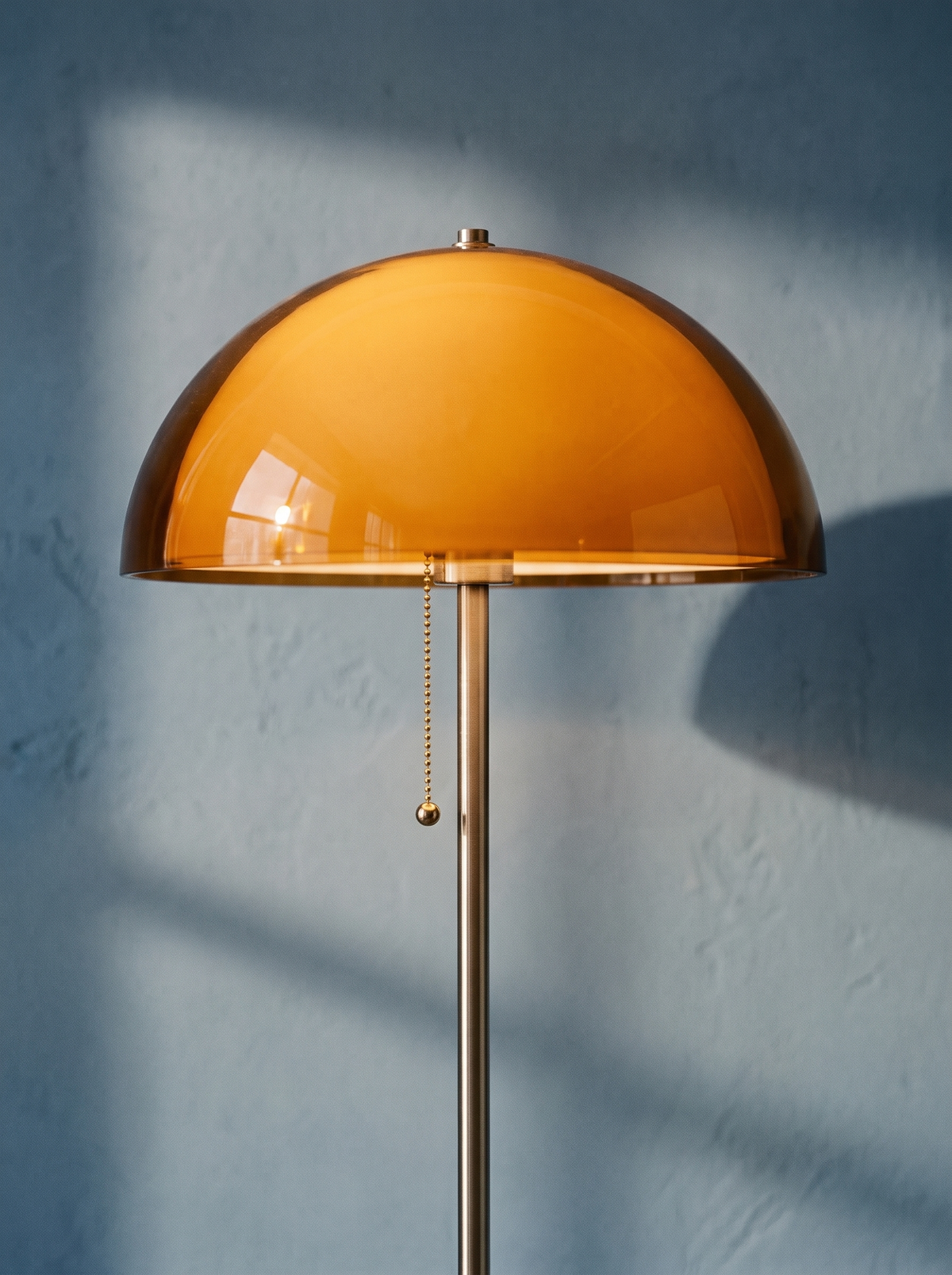 Lifestyle: close-up of Briar's amber dome and pull chain, lit