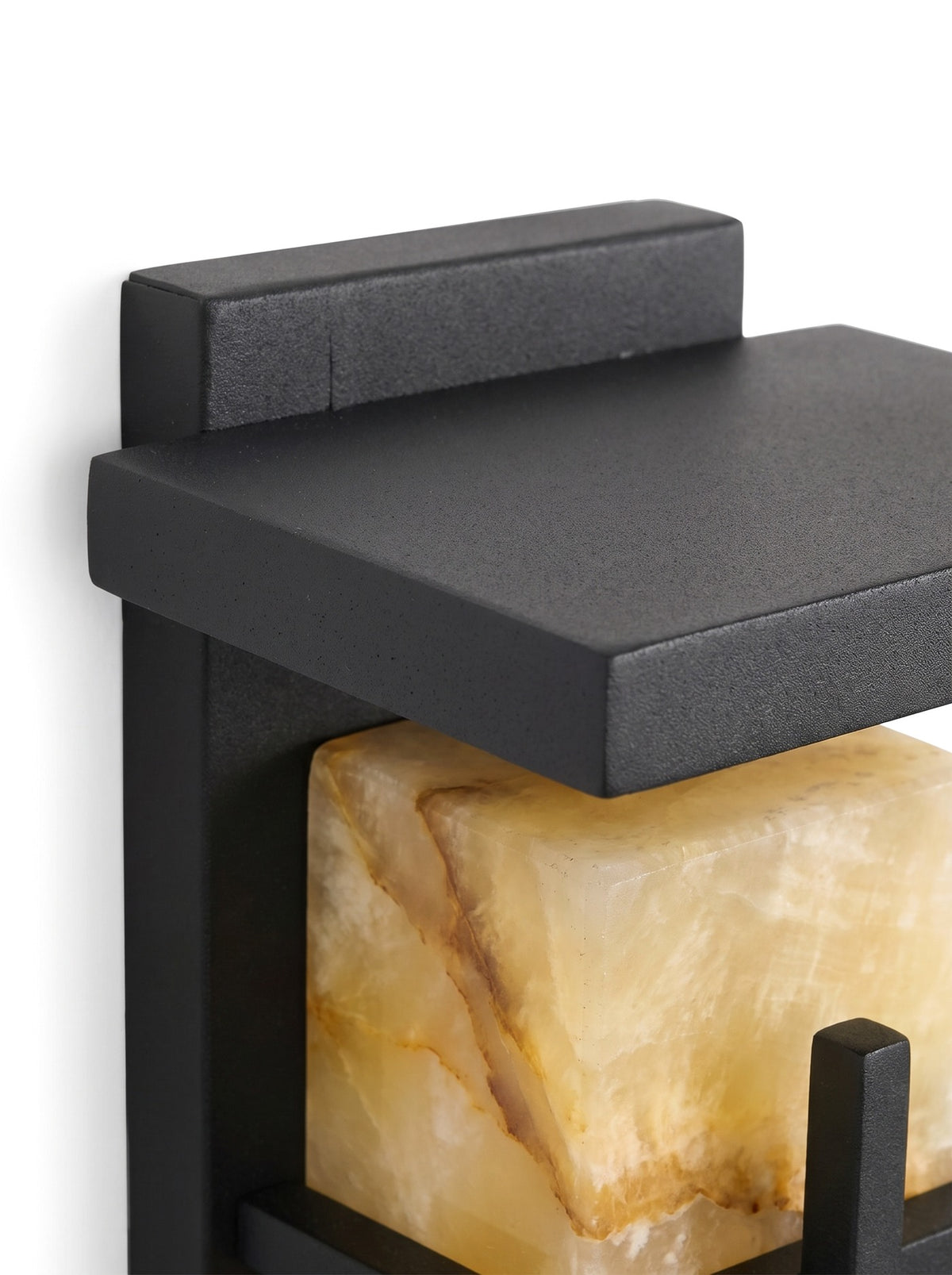 Close-up of the projecting top cap and wall bracket