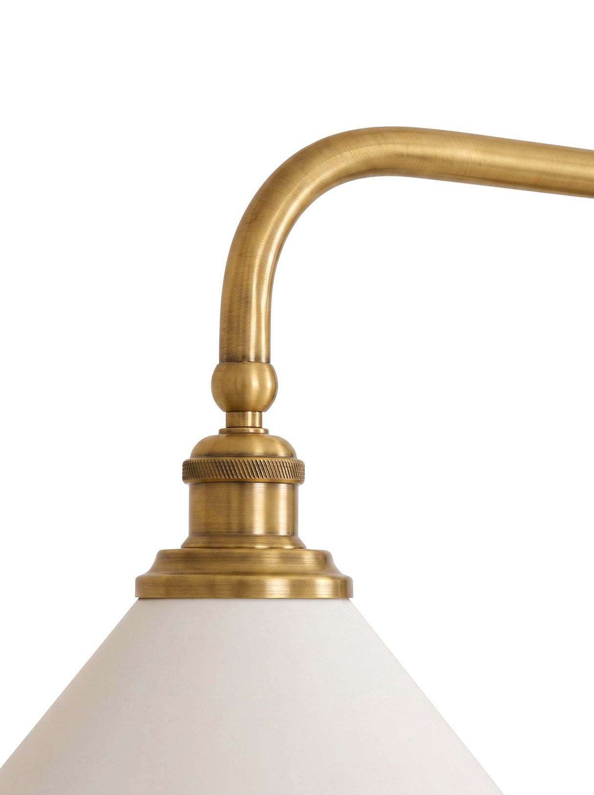 Close-up of the curved brass arm and shade fitting
