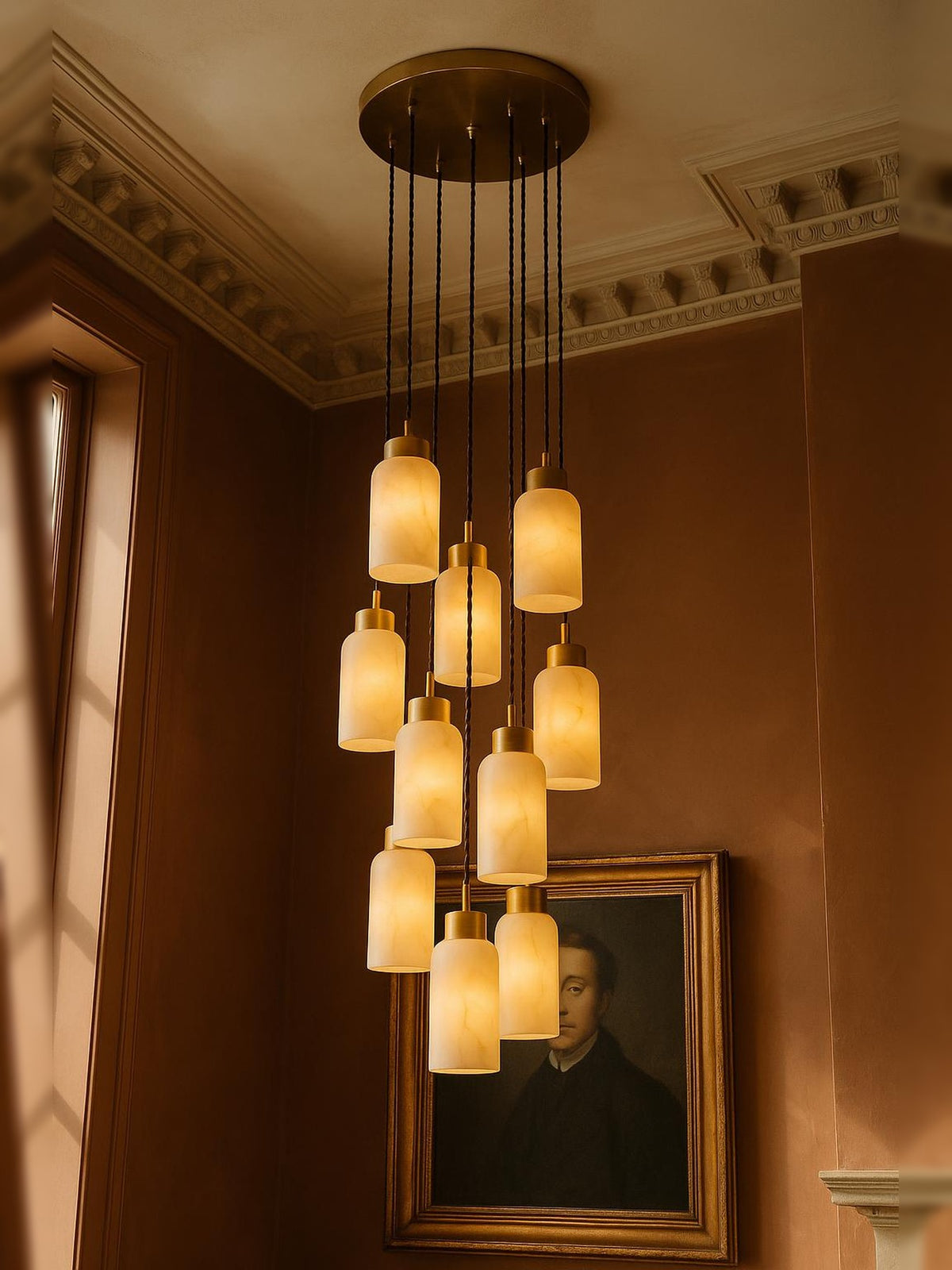 Sola eleven-pendant alabaster cluster pendant in brass in a sienna plaster corner