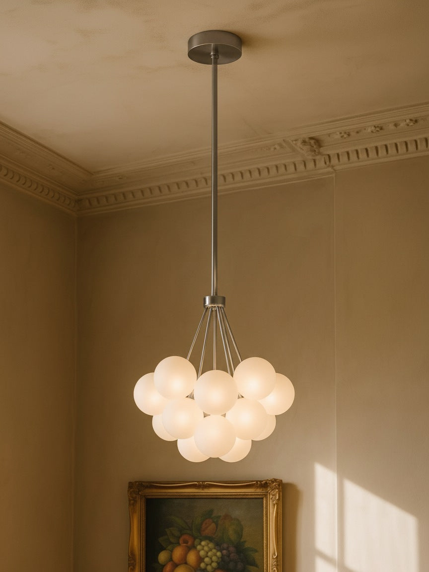 Perle 19-globe frosted glass bubble chandelier in chrome in a plaster-moulded corner
