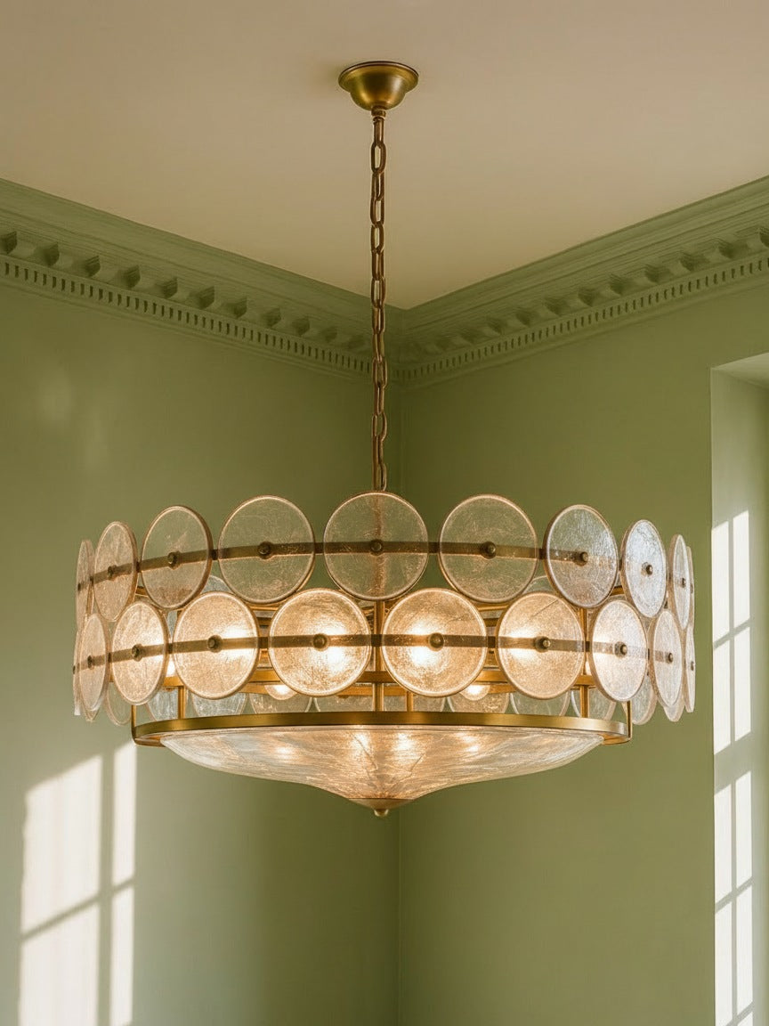 Soleil 31.5-inch clear glass disc chandelier hanging in a plaster-moulded corner