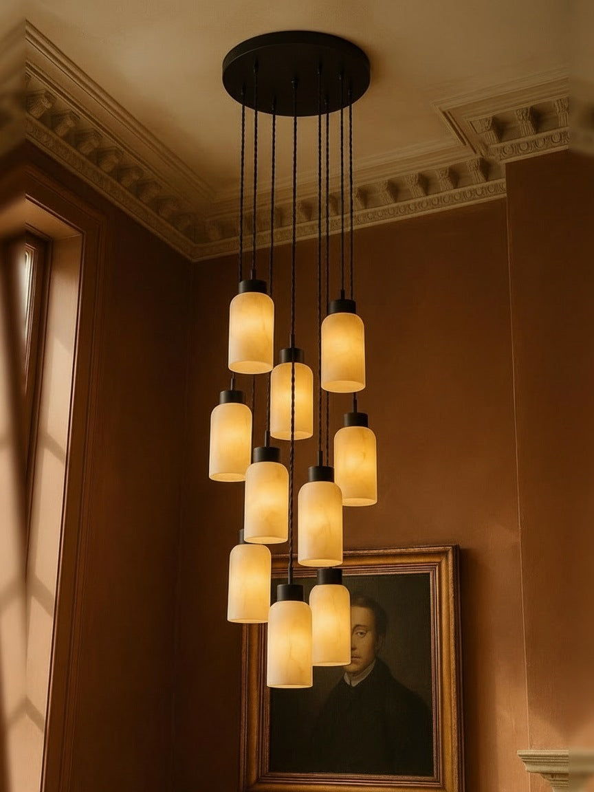 Sola eleven-pendant alabaster cluster pendant in black in a sienna plaster corner