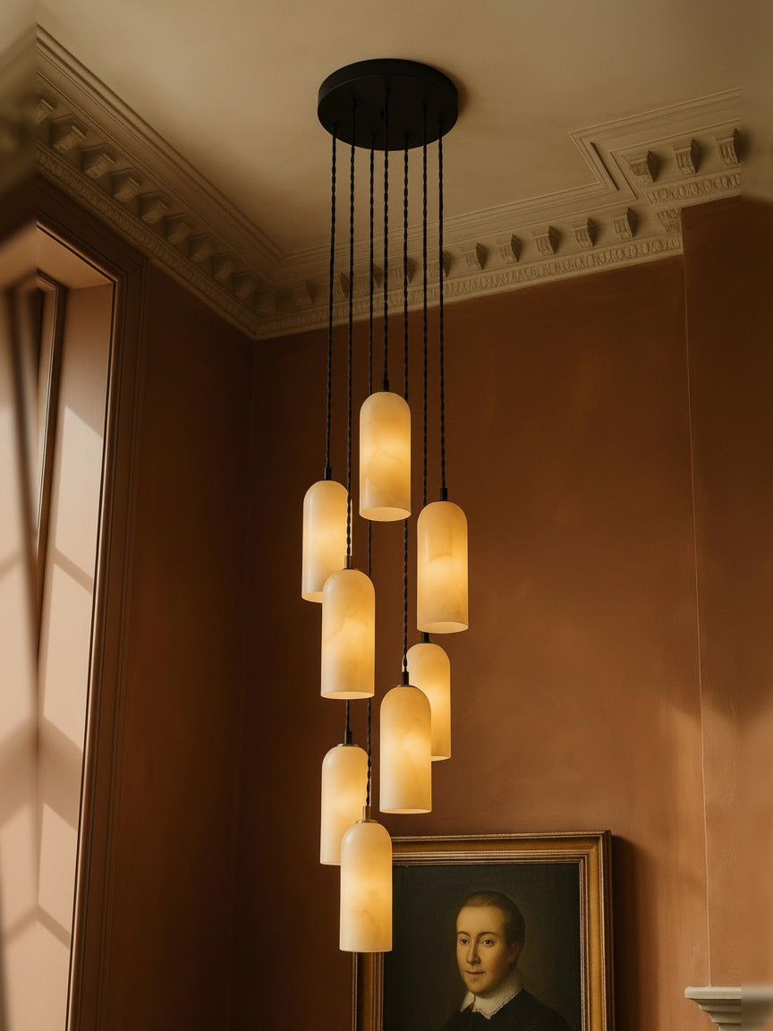Sola nine-pendant alabaster cluster pendant in black in a sienna plaster corner
