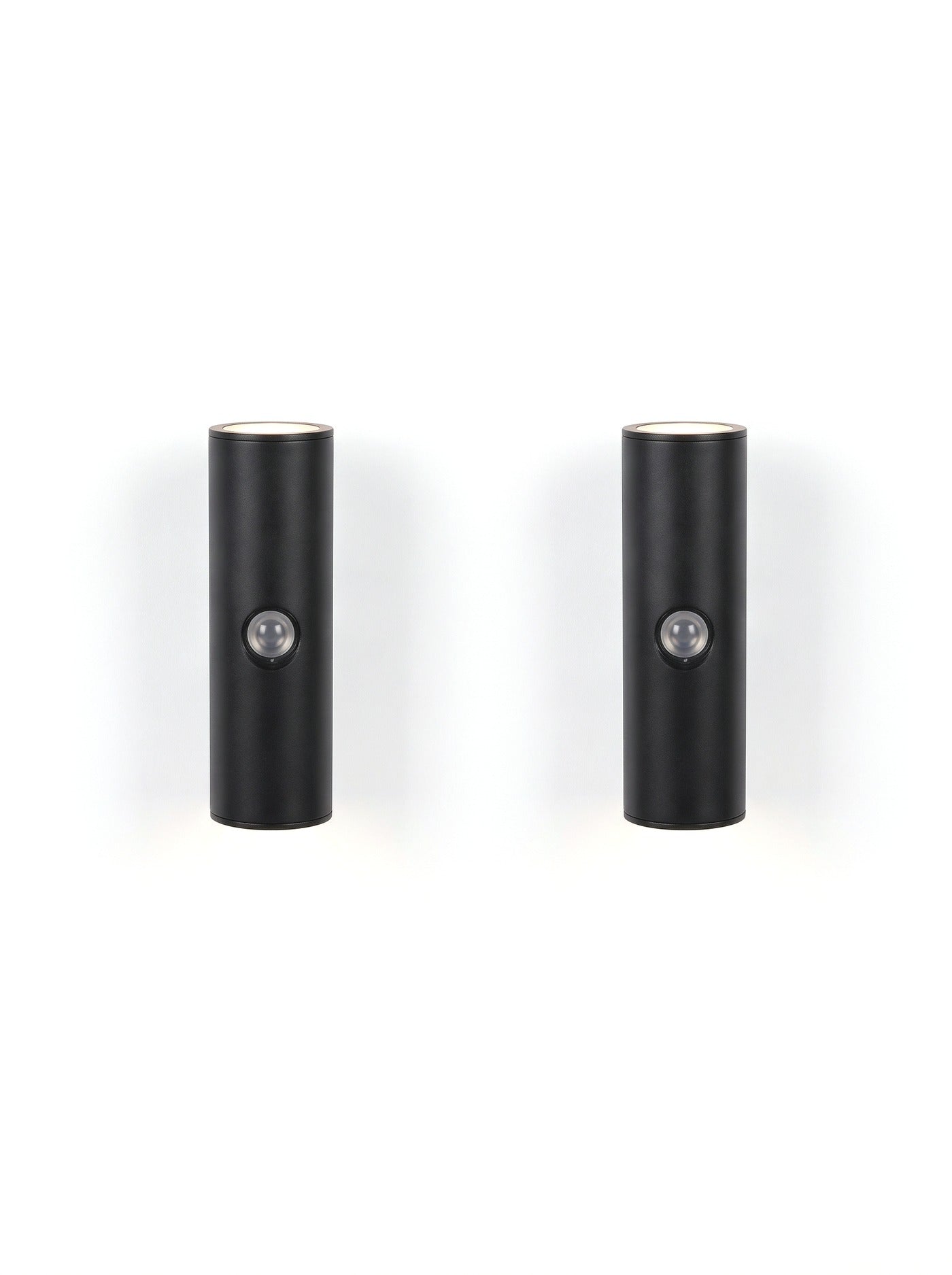A matched pair of Vega wall lights on white, glowing up and down