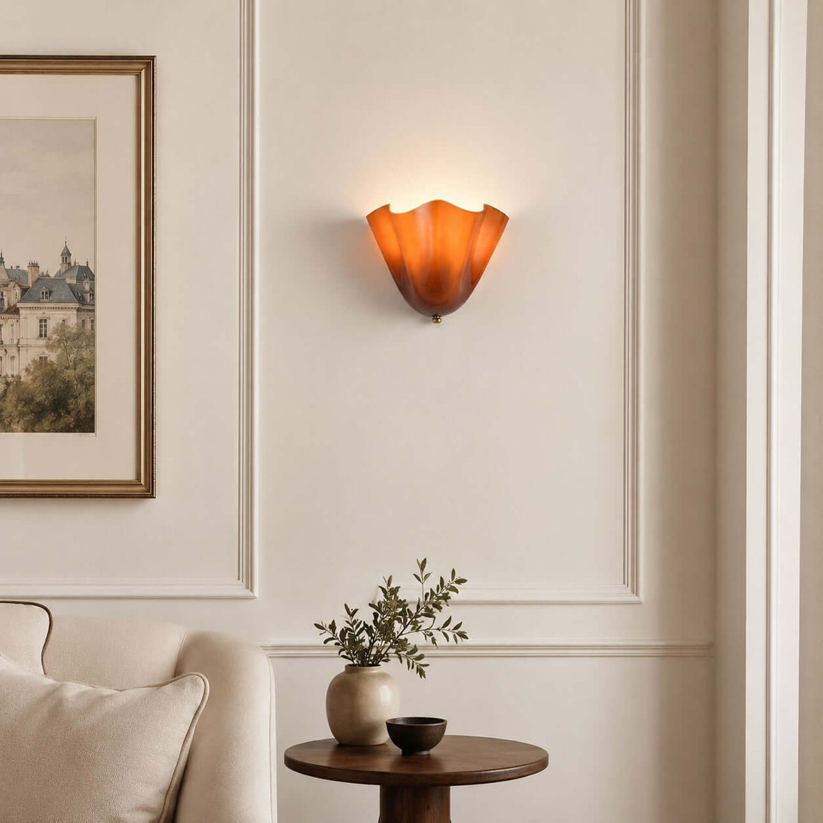 Zerane art glass wall sconce lit on a living room wall beside a sofa