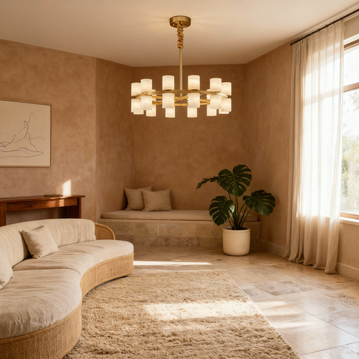 Enzo chandelier above a curved cream sofa, room scene