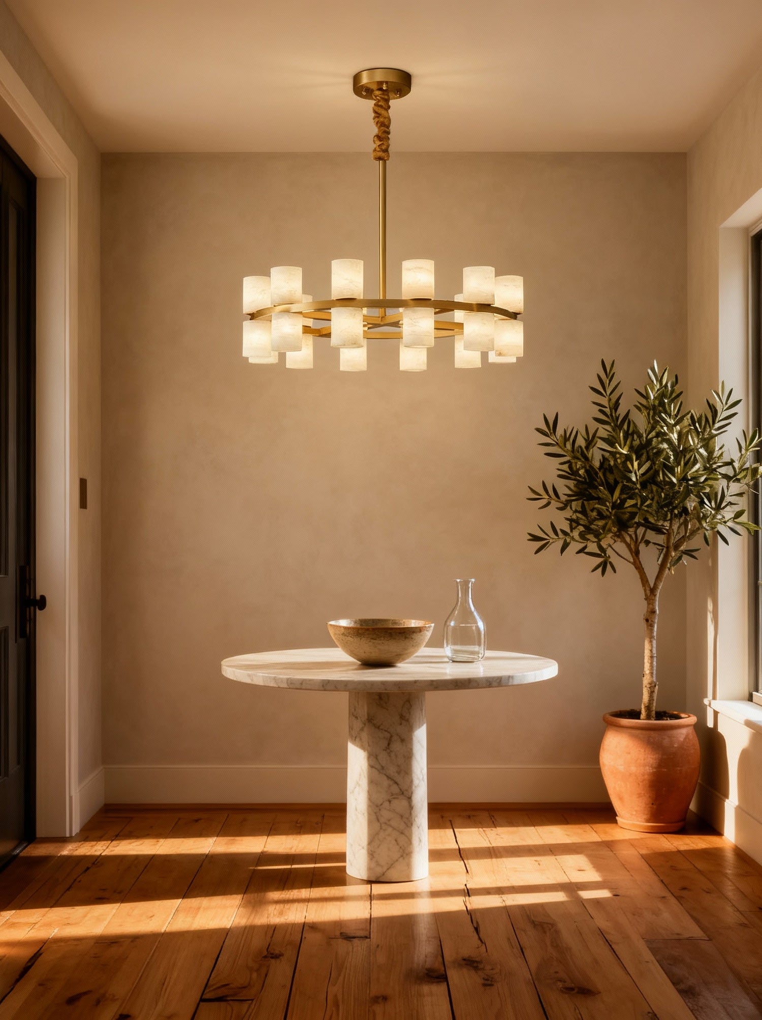 Enzo chandelier over a marble breakfast table, room scene