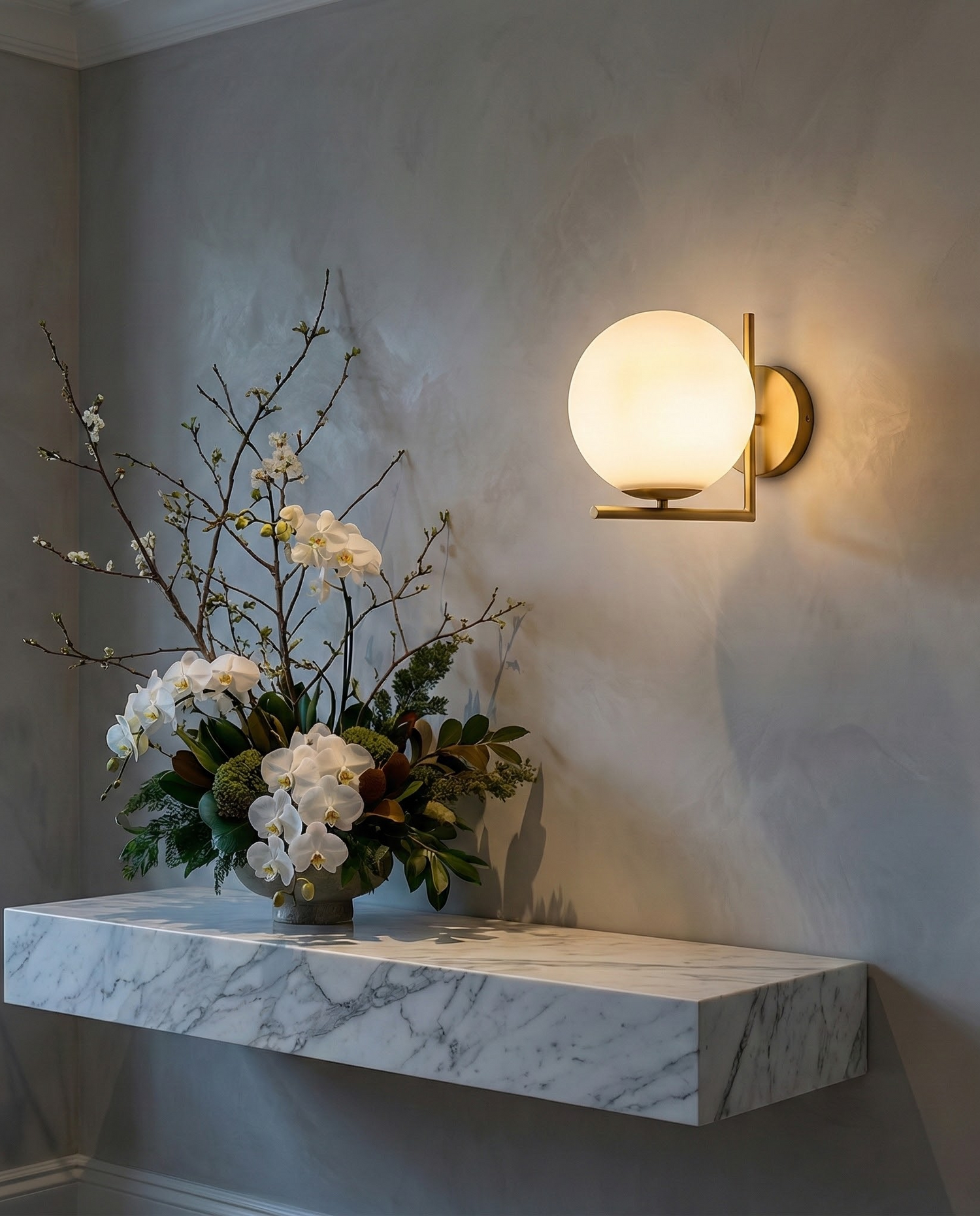 DaraLight globe sconce above a marble shelf, room scene