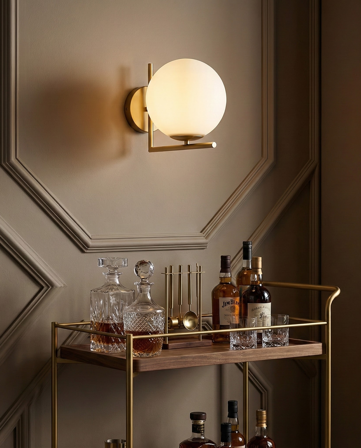DaraLight globe sconce above a brass bar cart, room scene