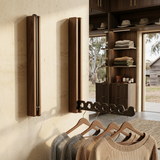 Nils hanger rails in walnut, arm extended