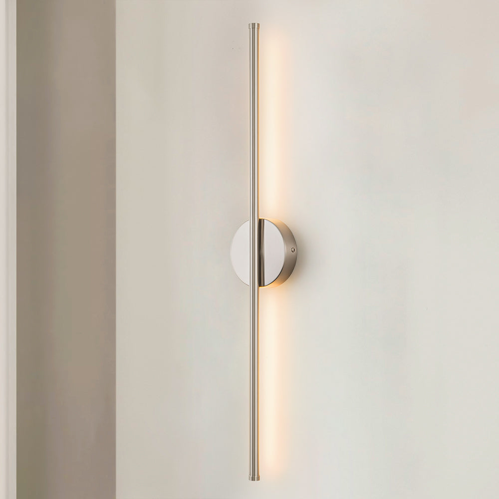 Metal LED wall sconce with modern finish and cozy warm glow