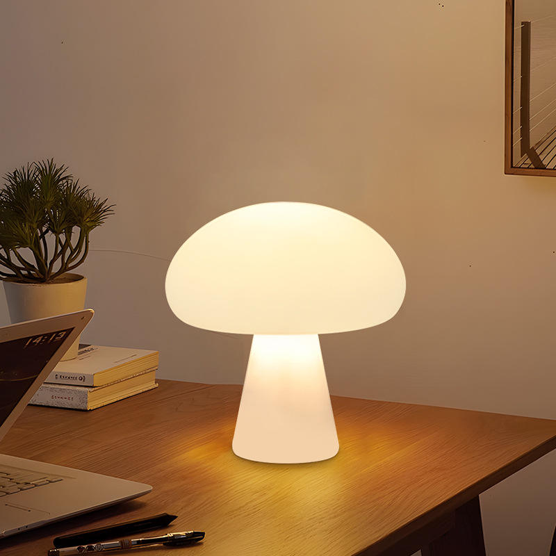 Ulla mushroom lamp on a desk with a laptop and plant