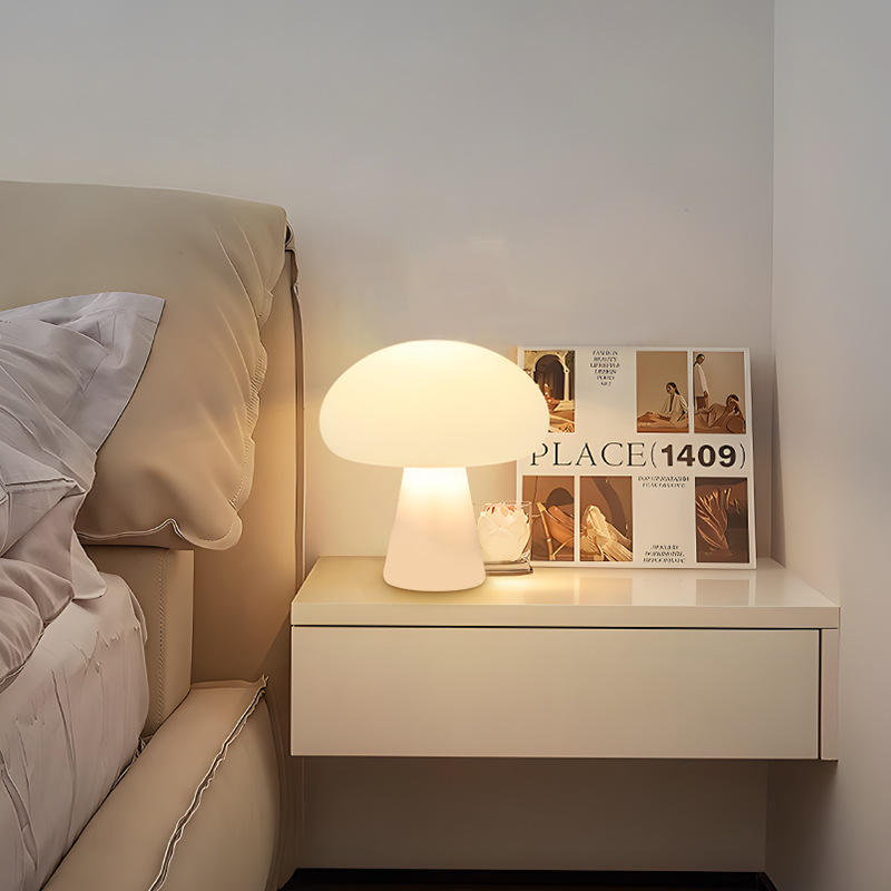 Ulla mushroom lamp glowing on a bedside nightstand