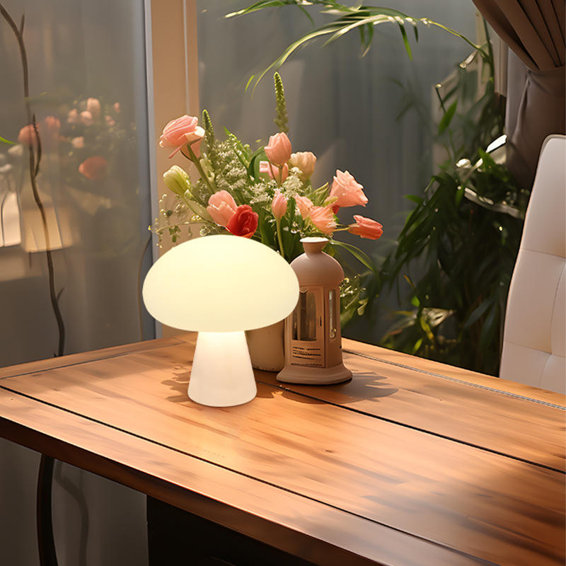 Ulla mushroom lamp on a wood table beside fresh flowers