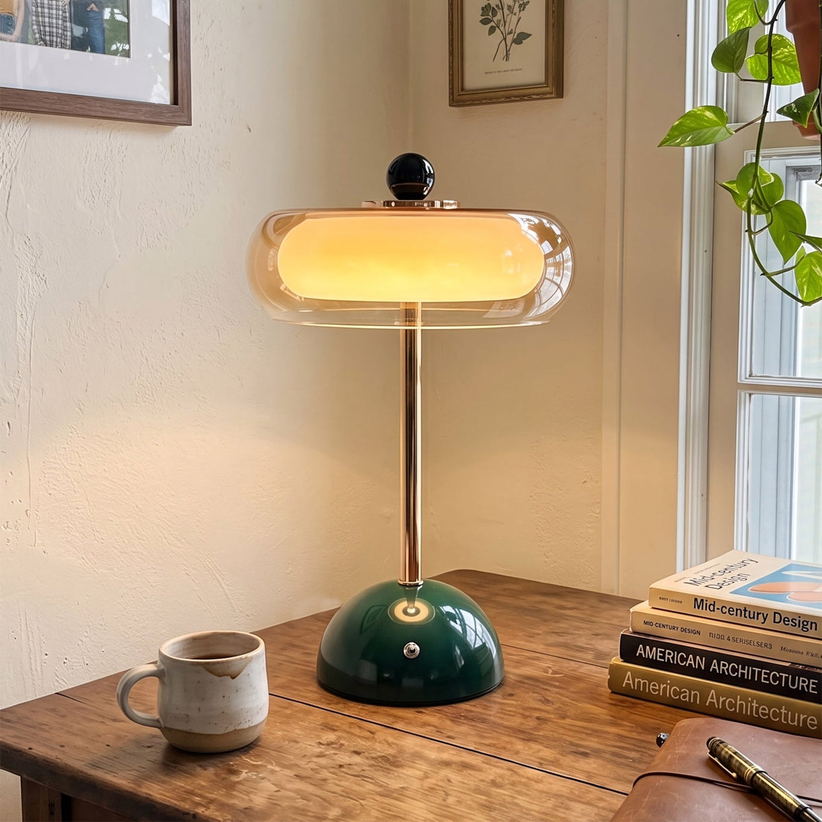Verdi rechargeable table lamp glowing warm amber on a bedroom nightstand