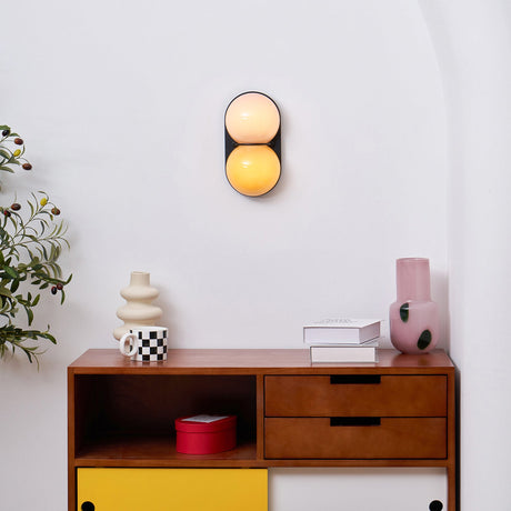 Matteo twin-globe sconce over a mid-century sideboard — lifestyle