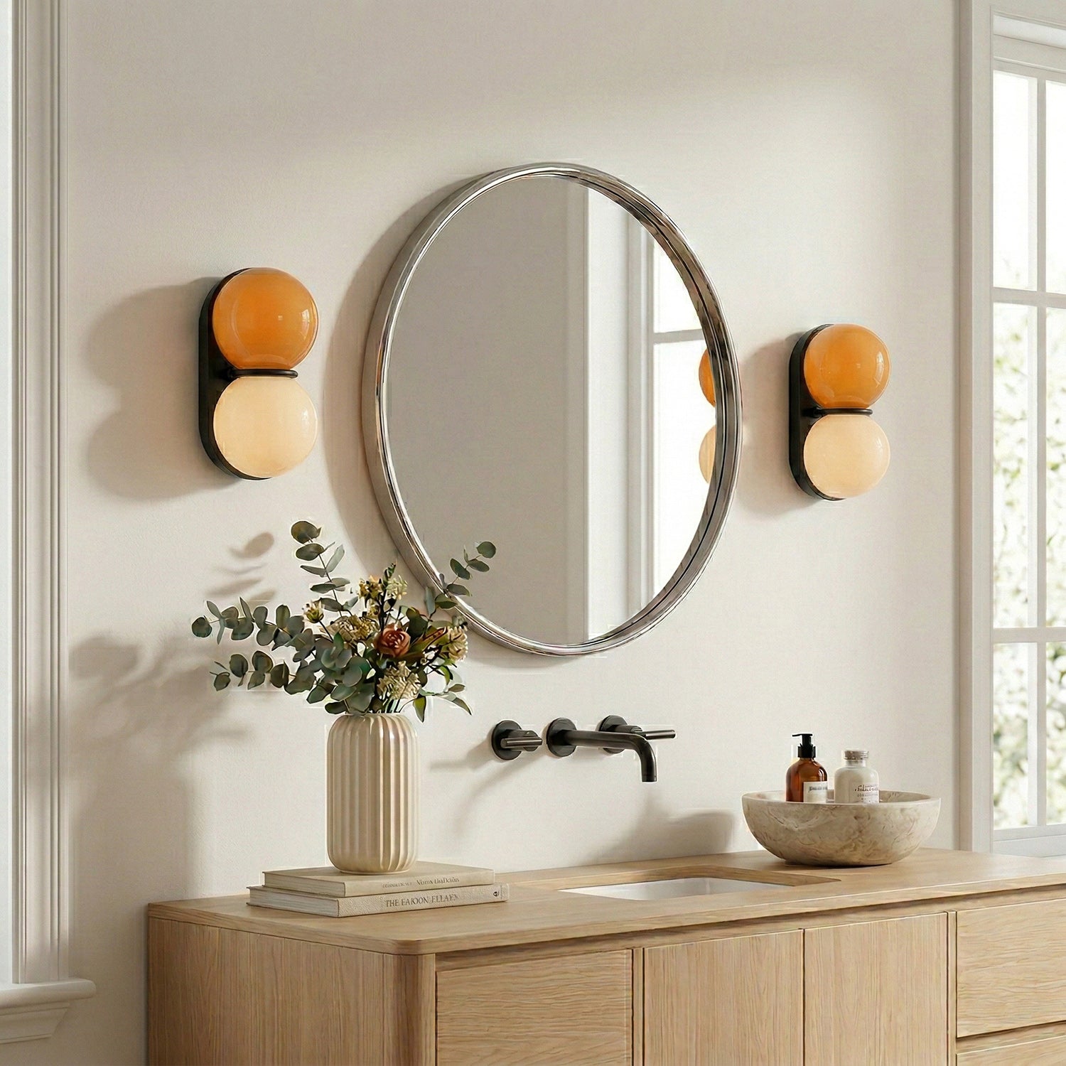 Matteo twin-globe sconces flanking a bathroom mirror — lifestyle