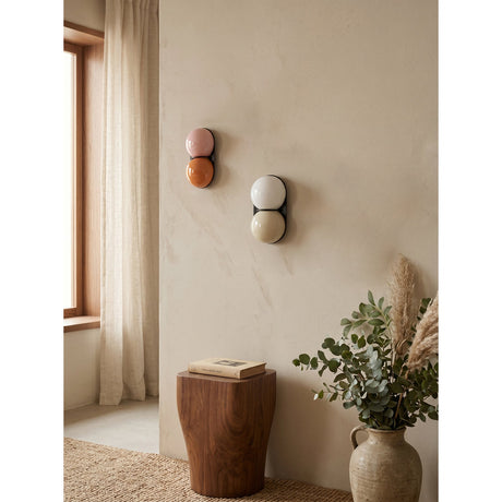 Matteo twin-globe sconces on a warm plaster wall — lifestyle