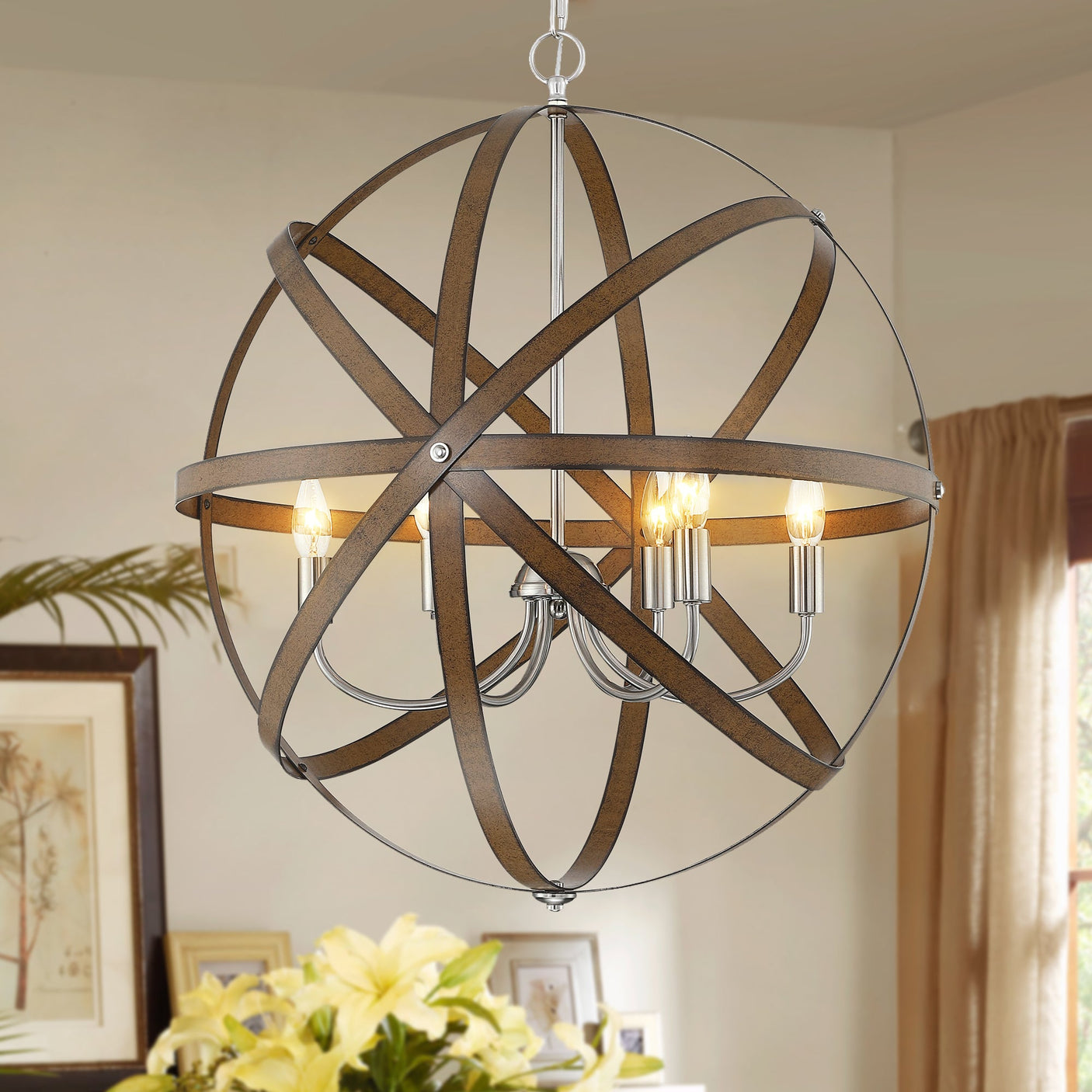 Ines orb pendant lit over a dining room — lifestyle
