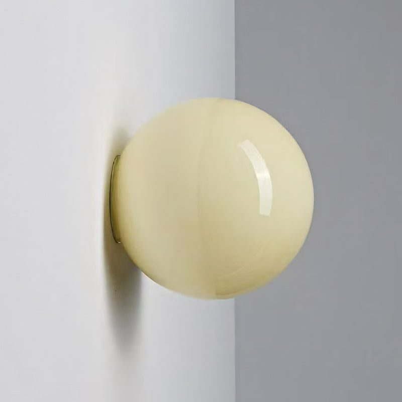 Oria pastel glass wall sconce in light yellow