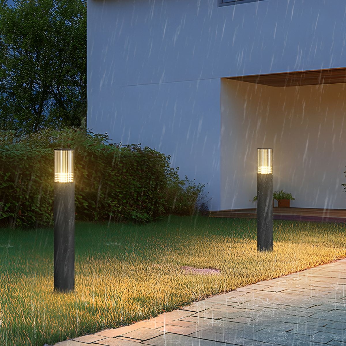 Tove garden bollard lights in a rainy backyard