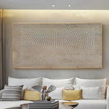 Wabi sabi textured wall art canvas in neutral tones above sofa