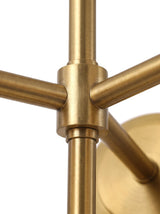 Astra central brass hub and arm joinery, close-up on white