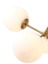 Astra two opal globes on brass arms, close-up on white