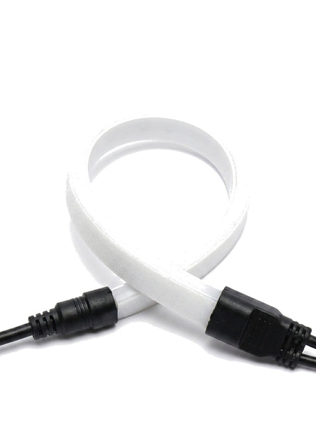 Filo strip bent around a tight radius with waterproof connector, close-up on white