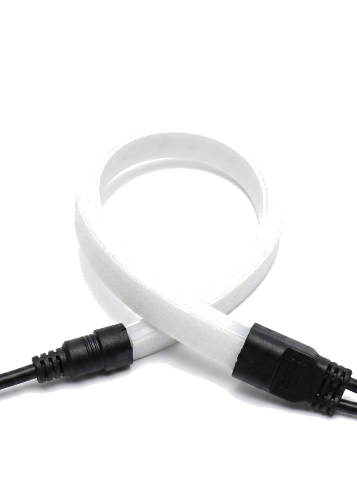 Filo strip bent around a tight radius with waterproof connector, close-up on white