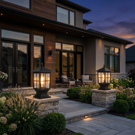 Gable coach lanterns flanking a modern home's front steps at dusk