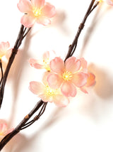 Close-up of the warm-glowing LED blossoms